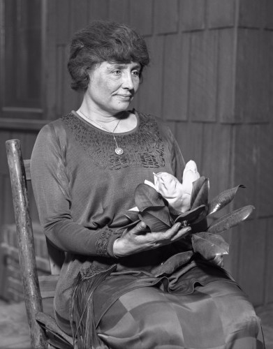 Los Angeles Times - Helen Keller holding a magnolia flower (circa 1920)